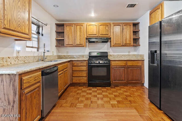 43667 Park Ave, Lancaster, CA 93534 - kitchen featuring open shelves, stainless steel appliances, under cabinet range hood, and brown cabinetry