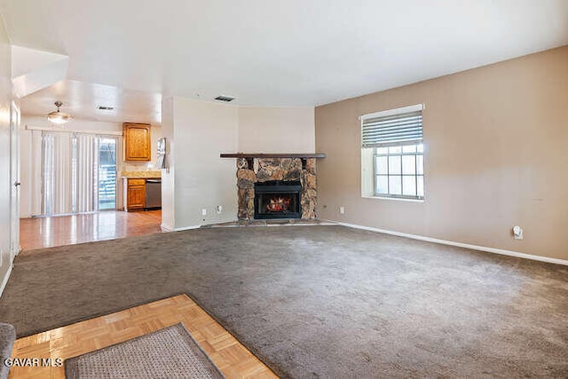 43667 Park Ave, Lancaster, CA 93534 - unfurnished living room featuring baseboards and a fireplace