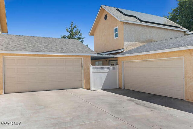 43667 Park Ave, Lancaster, CA 93534 - garage featuring concrete driveway