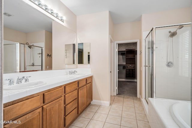 42638 Meridian Way, Lancaster, CA 93536 - full bathroom with a stall shower, tile patterned floors, double vanity, a garden tub, and a walk in closet