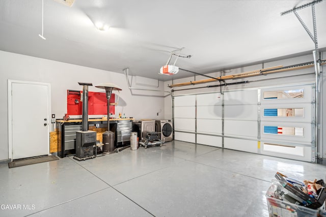 42638 Meridian Way, Lancaster, CA 93536 - garage featuring a garage door opener and separate washer and dryer