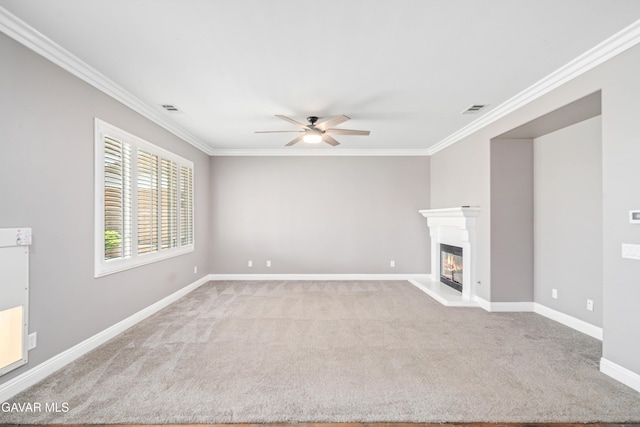 42638 Meridian Way, Lancaster, CA 93536 - unfurnished living room featuring crown molding, ceiling fan, carpet, and a glass covered fireplace