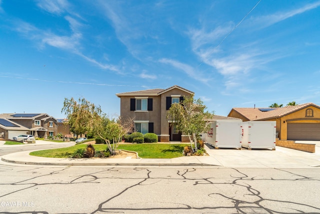 42638 Meridian Way, Lancaster, CA 93536 - view of front of property with driveway, stucco siding, a residential view, and a garage