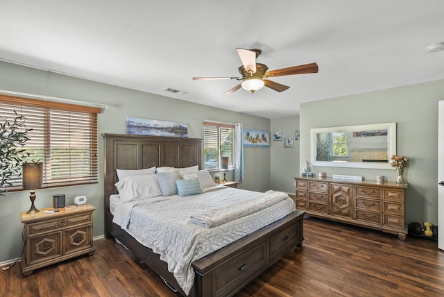 bedroom featuring ceiling fan and dark wood-type flooring