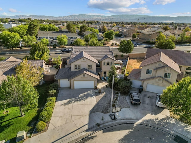 birds eye view of property with a mountain view