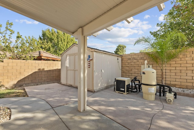 view of patio with a storage shed