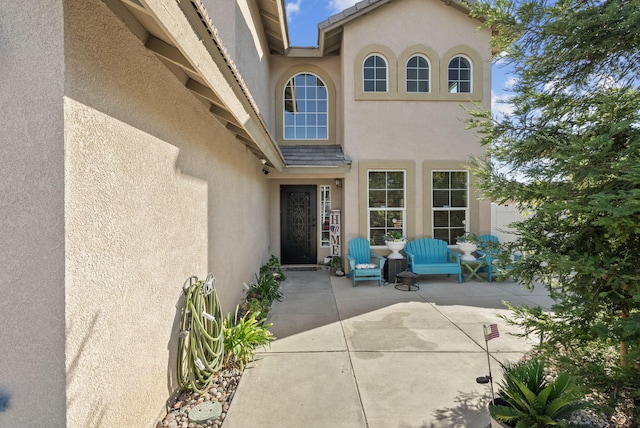 property entrance with a patio