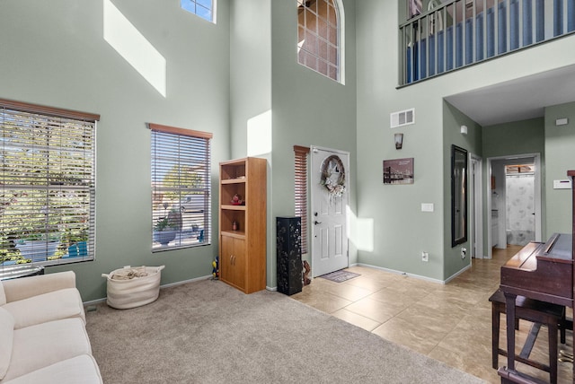 interior space with a healthy amount of sunlight and a high ceiling