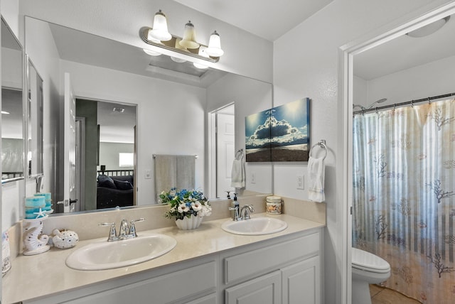 full bathroom featuring vanity, toilet, and shower / bathtub combination with curtain