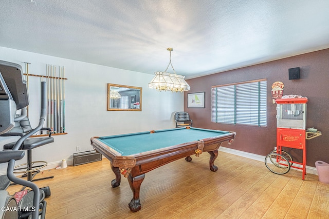 1776 Blackberry Ct, Palmdale, CA 93551 - playroom with light wood-style flooring, pool table, and a textured ceiling
