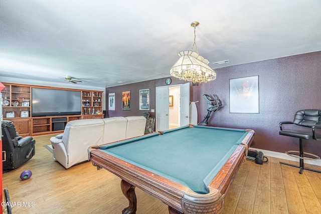 1776 Blackberry Ct, Palmdale, CA 93551 - recreation room with a textured wall, light wood-type flooring, billiards, ceiling fan, and a chandelier
