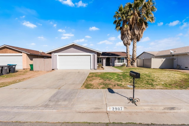 ranch-style house with an attached garage, driveway, fence, and a front yard