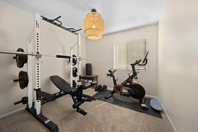 exercise room with baseboards