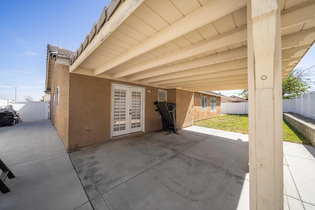 view of patio featuring french doors and a fenced backyard