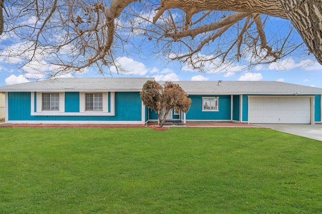 single story home featuring a garage and a front lawn