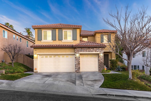 mediterranean / spanish house featuring a garage