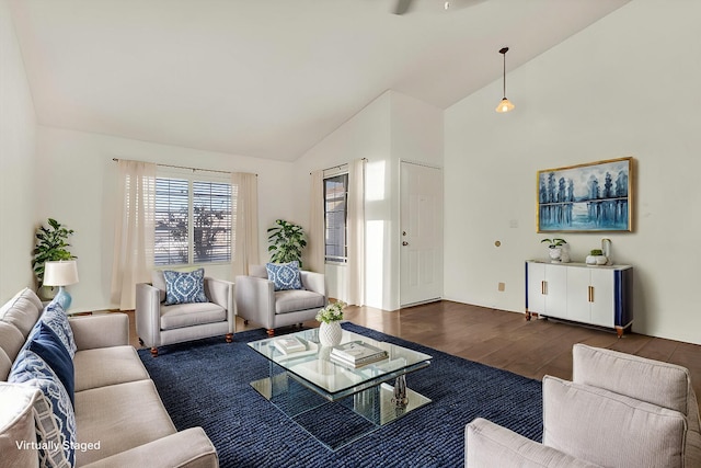 living room with vaulted ceiling and dark wood-type flooring