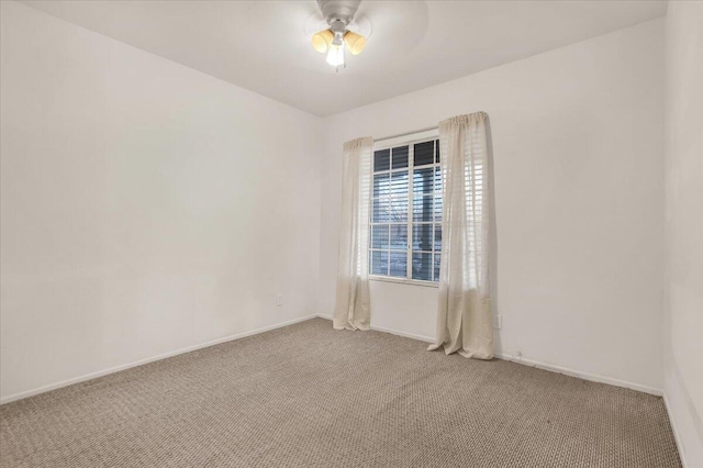 carpeted empty room with ceiling fan