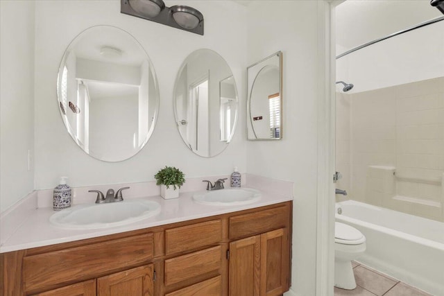 full bathroom with vanity,  shower combination, tile patterned floors, and toilet