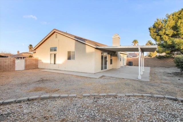 back of property with a patio area