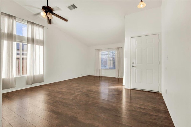 interior space with vaulted ceiling, ceiling fan, and dark hardwood / wood-style flooring