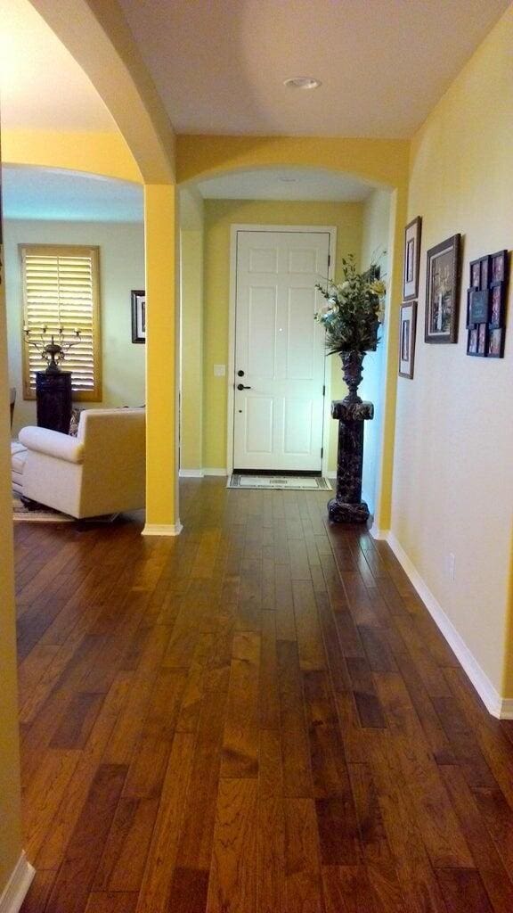 corridor featuring dark wood-type flooring