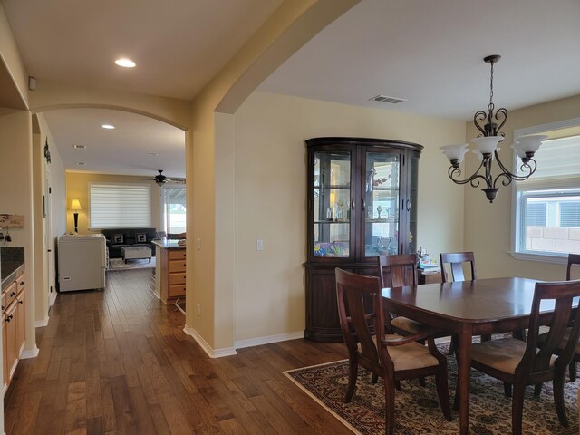 kitchen with sink, stainless steel appliances, an island with sink, and a kitchen bar