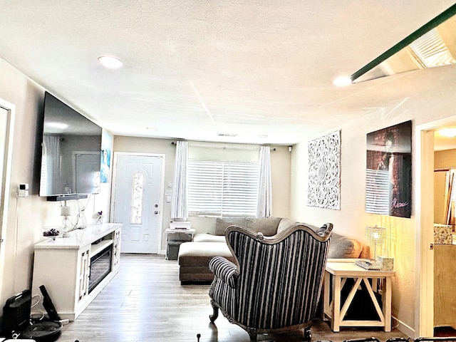 43744 Beech Ave, Lancaster, CA 93534 - living area with wood finished floors, a textured ceiling, and recessed lighting