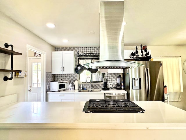 43744 Beech Ave, Lancaster, CA 93534 - kitchen with stainless steel fridge with ice dispenser, a sink, white microwave, stovetop, and decorative backsplash