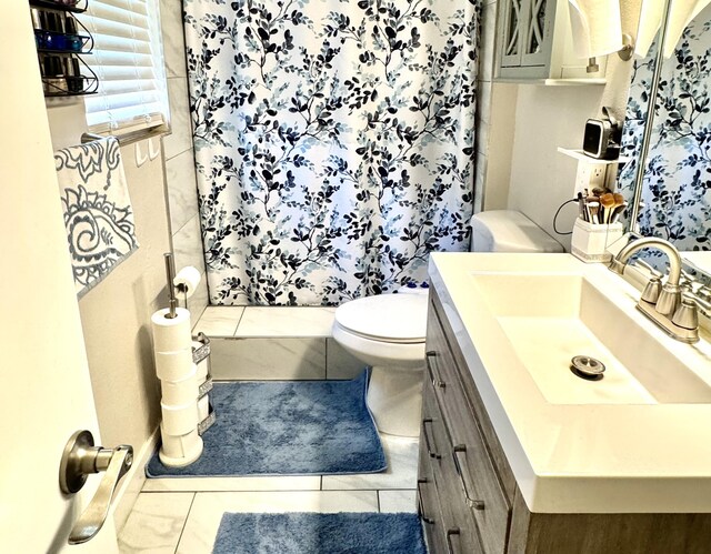 43744 Beech Ave, Lancaster, CA 93534 - bathroom with vanity, toilet, and tile patterned flooring