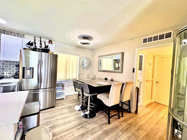 43744 Beech Ave, Lancaster, CA 93534 - dining room featuring light wood-type flooring, baseboards, and a desk