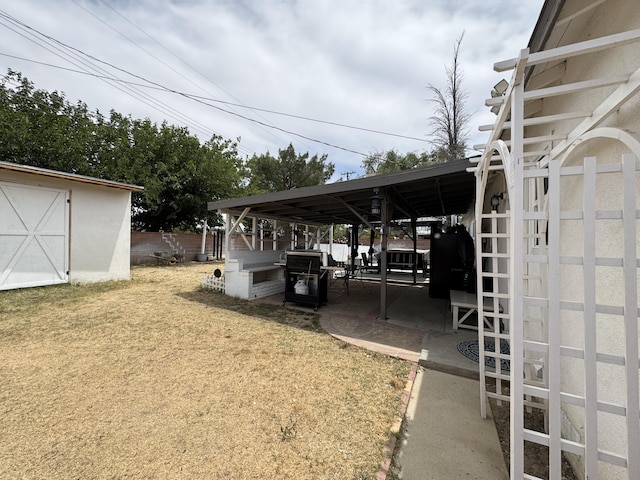 43744 Beech Ave, Lancaster, CA 93534 - view of car parking featuring a storage unit