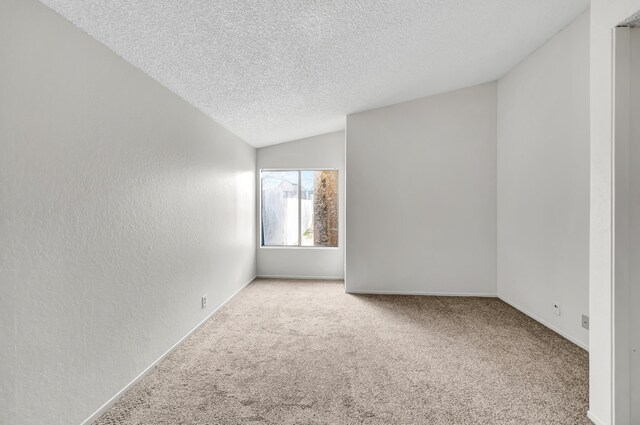 2820 S S Ave, Palmdale, CA 93550 - carpeted spare room with vaulted ceiling, a textured wall, and a textured ceiling
