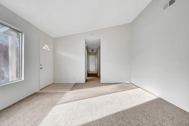 2820 S S Ave, Palmdale, CA 93550 - spare room with visible vents, light tile patterned floors, and light carpet