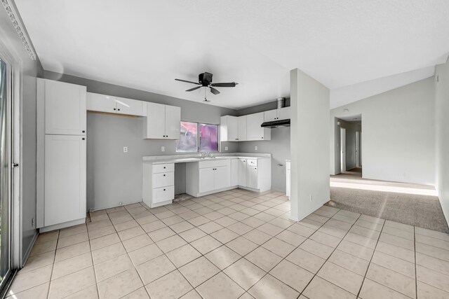 2820 S S Ave, Palmdale, CA 93550 - kitchen with light countertops, a sink, a ceiling fan, white cabinetry, and light tile patterned floors