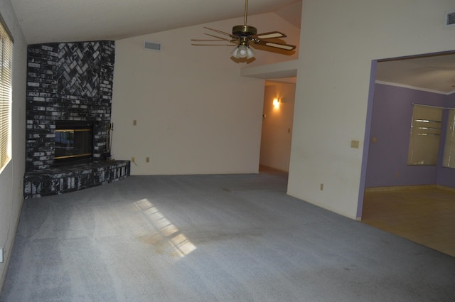 unfurnished living room featuring a brick fireplace, visible vents, carpet flooring, and a ceiling fan