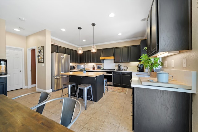 kitchen with range hood, stainless steel appliances, light countertops, a kitchen bar, and light tile patterned flooring