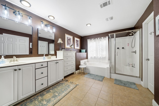 full bath with a garden tub, a stall shower, a sink, and visible vents