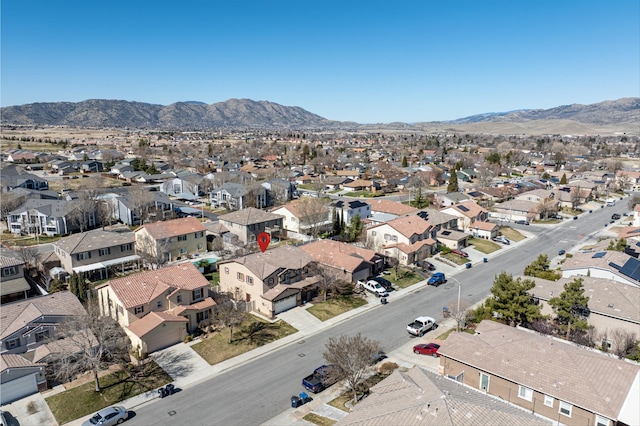 drone / aerial view with a residential view and a mountain view