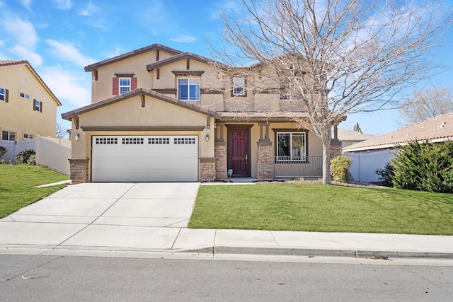 view of front of home with stucco siding, fence, concrete driveway, and a front yard