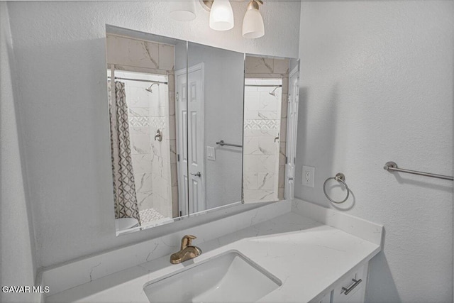 1109 W W Ave Unit J8, Lancaster, CA 93534 - bathroom with a textured wall, vanity, and a shower with curtain
