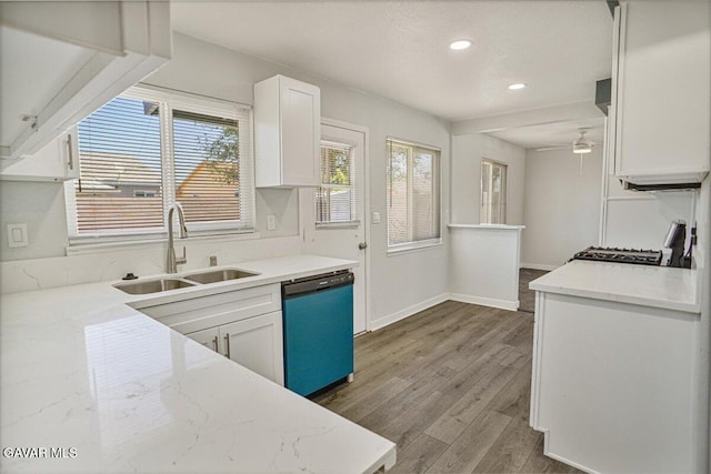 1109 W W Ave Unit J8, Lancaster, CA 93534 - kitchen with dishwasher, range, white cabinets, wood finished floors, and ceiling fan