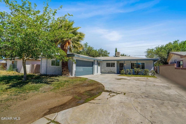 1109 W W Ave Unit J8, Lancaster, CA 93534 - view of front of property with a garage, driveway, and stucco siding