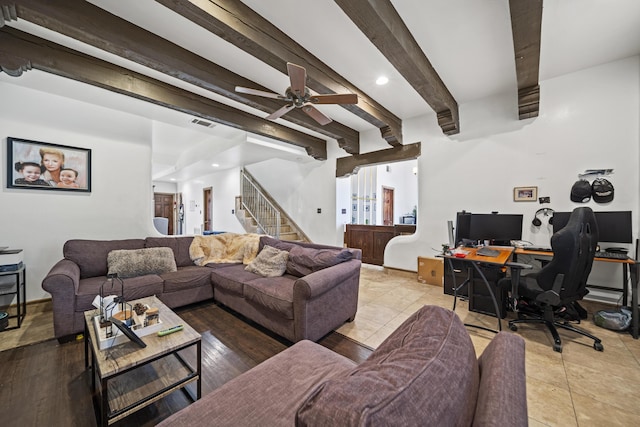 tiled living room featuring beam ceiling and ceiling fan