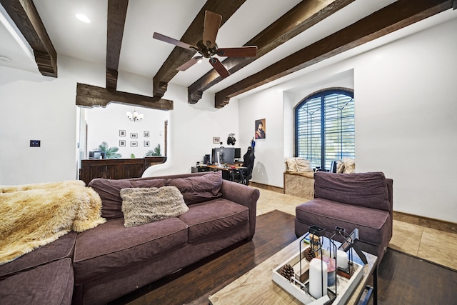 living room with beamed ceiling, hardwood / wood-style floors, and ceiling fan with notable chandelier