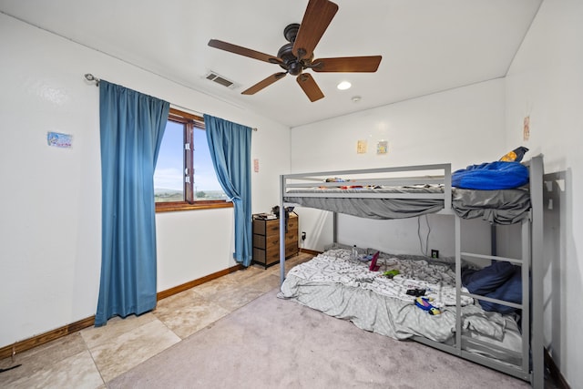 tiled bedroom with ceiling fan