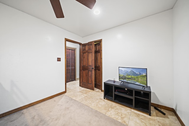 interior space featuring ceiling fan and light tile patterned floors