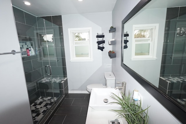 full bath with recessed lighting, toilet, a shower stall, tile patterned flooring, and baseboards