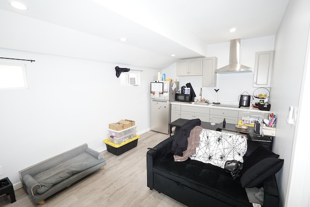 living room featuring light wood-style floors, recessed lighting, lofted ceiling, and baseboards