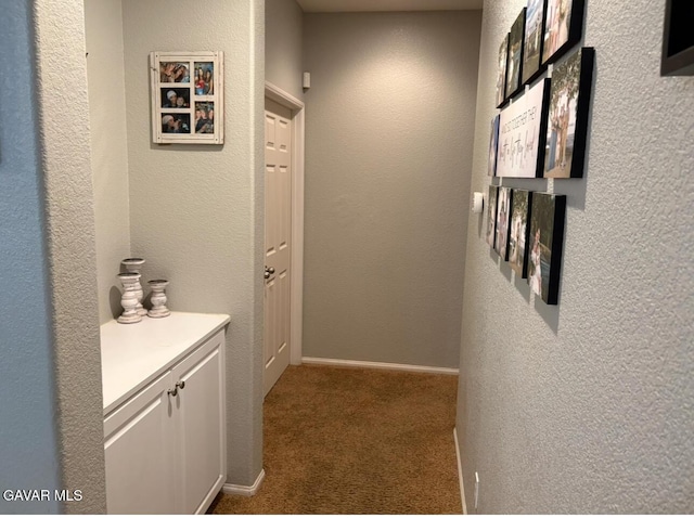 3309 W Brabham Ave, Rosamond, CA 93560 - corridor featuring carpet floors and a textured wall